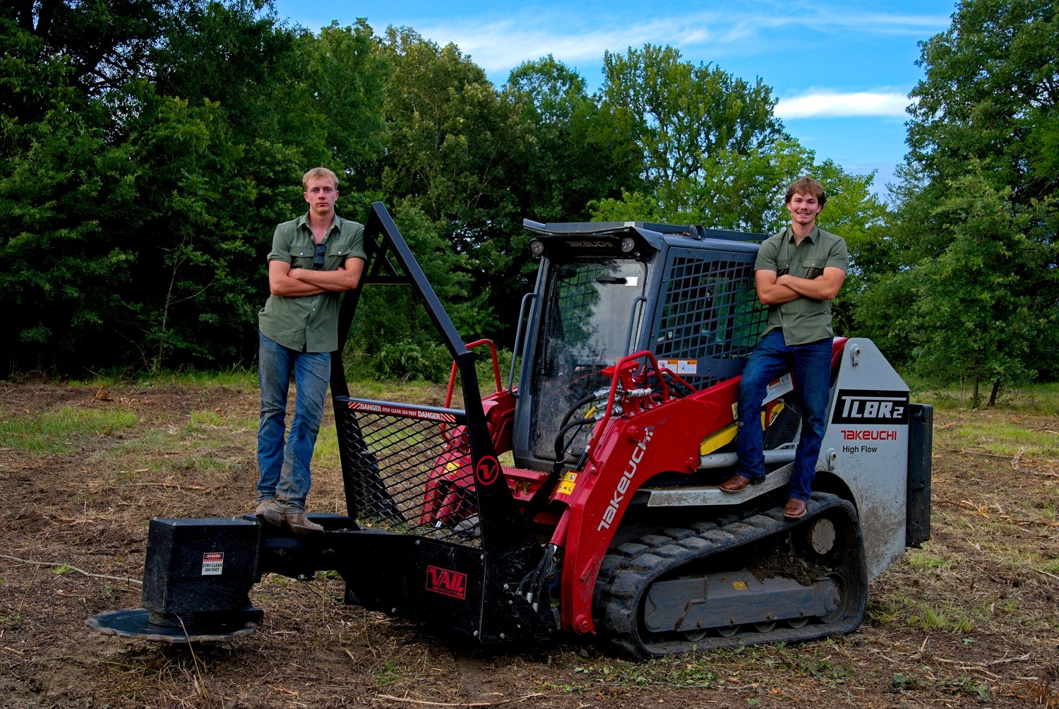 Caleb and Holter on the skid steer
